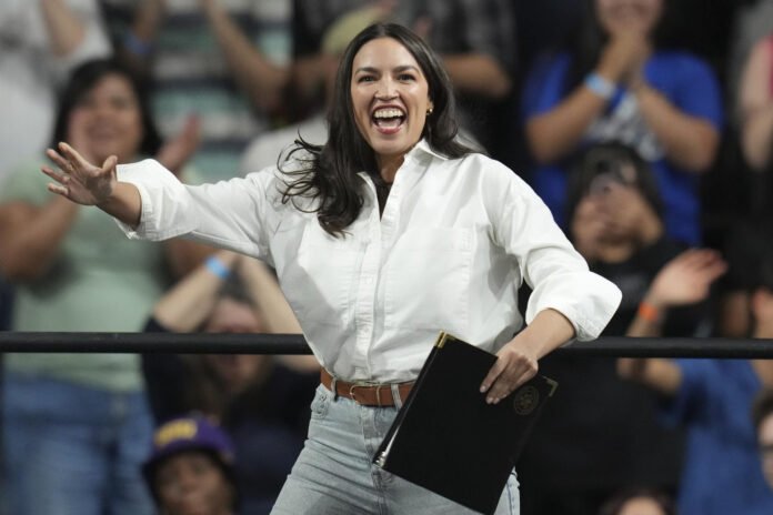 Rep Alexandria Ocasio-Cortez D NY arrives to speak during a Fighting Oligarchy tour event at Arizona State University on Thursday AP Photo Ross D Franklin 250325 - Trump 2 - democratici - Alexandria Ocasio-Cortez