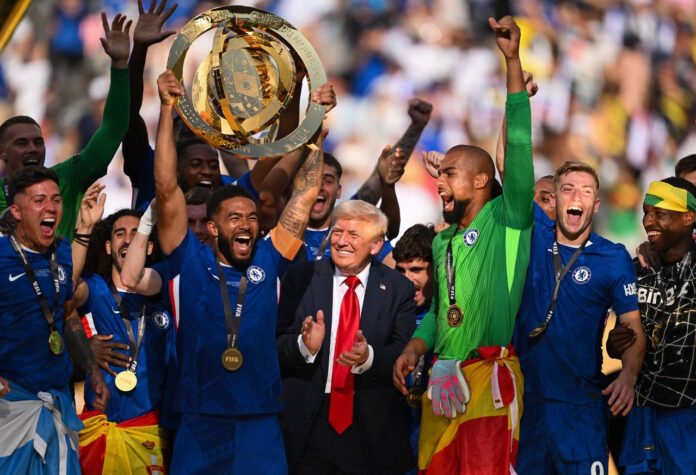 Chelsea Reece James of Chelsea FC lifts the FIFA Club World Cup trophy after their team's victory Sunday as President Donald Trump watches at MetLife Stadium David Ramos Getty Images 250720 - Trump 2 - Chelsea